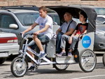 В Алматы начали курсировать первые велотакси