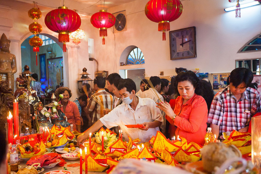 Burning incense in the temple for good luck and prosperity, Chinese New Year