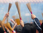 Burning incense in the temple for good luck and prosperity for the New Year