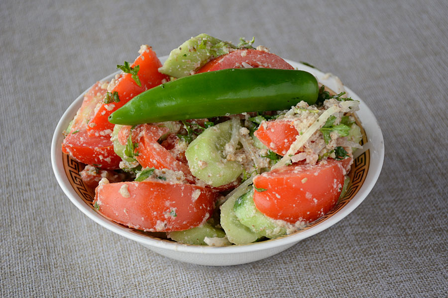 Georgian Food. Cucumber, tomato salad with walnuts
