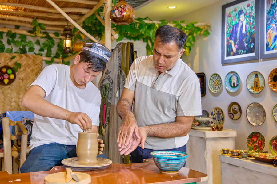 Vakhobjon Buvayev with his students in his own workshop-studio