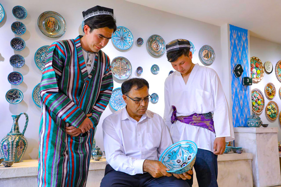Vakhobjon Buvayev with his students in his own workshop-studio